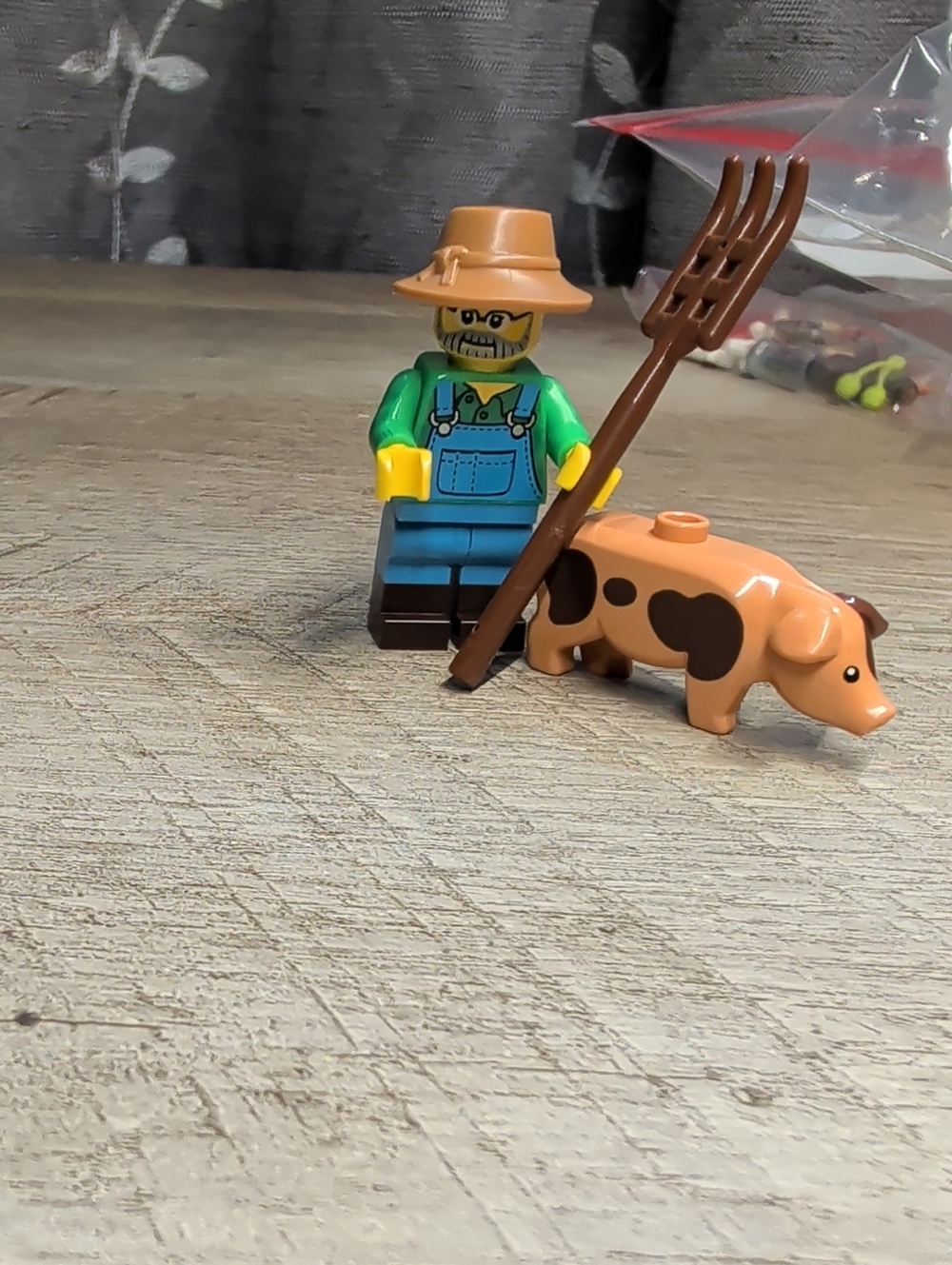 LEGO Farmer Minifigure with Pitchfork and Pig